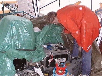 Arvid checks for rain damage after the downpour