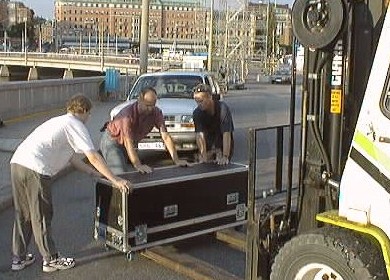 One of the Chroma 5 lasers is carefully placed on the forks before being hoisted 